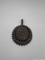 Front view of the marcasite sterling silver pendant showing oval shape and intricate marcasite stone pattern.