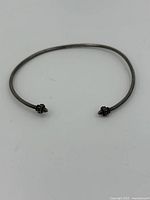 Full view of the sterling silver open cuff bangle bracelet, showing overall shape and design.