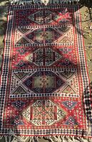 Full view of carpet showing overall design and fringe