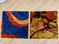 Both floor mats side-by-side on floor showing size and patterns