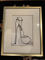 Frontal view of framed Billy Cone shoe drawing