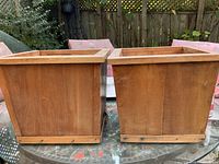 front view of both square wooden planters