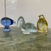 Front view of all three crystal bird figurines