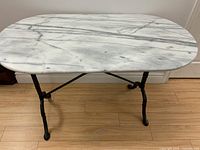 Top view showing oval marble surface and veining