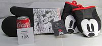Minnie and Mickey Mouse oversized oven mitts, displayed with a Coke can for size reference, Minnie mitt includes attached tag featuring Minnie Mouse character
