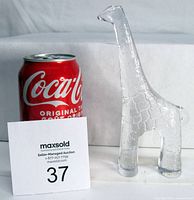 Front view of clear crystal giraffe with Coca-Cola can for size comparison; about 7 inches tall, textured surface mimicking giraffe pattern.
