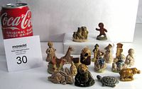Photo showing all 17 Wade Red Rose figurines arranged with a Coca-Cola can for scale, including Gingerbread Man, Three Bears, and various animals and human figures.