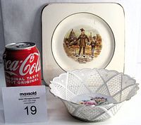 Both china pieces with a soda can for scale: lattice porcelain bowl in front with antique square plate behind.