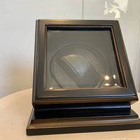 Front angled view showing glass lid and interior drum