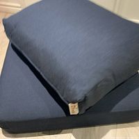 Both cushions stacked showing color and tags
