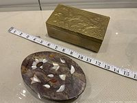 Both boxes beside measuring tape showing approx lengths