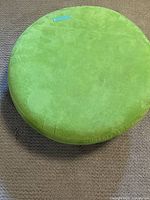 Top view showing the green fabric-covered surface with discoloration spots and wear.