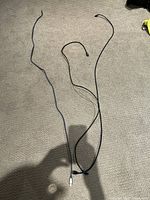 Three HDMI cables laid out on carpet, showing full length and connectors.