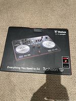 Box of Vestax Typhoon DJ controller showing product image and branding