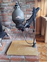 Full side view of the PIXUR photographic enlarger mounted on baseboard, showing its overall structure and details.