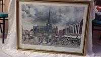 Framed print showing a street scene in Birmingham's Bullring area with a church spire and market stalls.