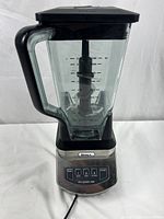 Full view of Ninja Pro System 1100 kitchen blender with attached glass jar, showing overall condition and details.