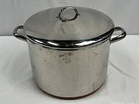 Full view of stainless steel pot with copper bottom and lid