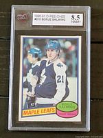 Front of 1980-81 O-Pee-Chee Borje Salming hockey card with KSA 8.5 grade label in protective case.