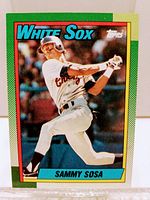 Front of the 1990 Topps Sammy Sosa baseball card in White Sox uniform, card number 692 showing player in action batting pose.