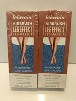 Photo of two boxed Lakerain Airbrush Leg Effect leg makeup bottles sealed in plastic.