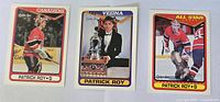 Front of three Patrick Roy hockey cards in mint condition featuring Canadiens, Vezina Trophy, and All-Star cards.