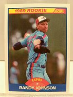 Front of 1989 Randy Johnson Rookie Card showing pitching action in Expos uniform with 1989 Rookie banner and Score logo