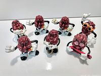 Photo showing all 7 California Raisins figurines together, showcasing different poses and musical instruments.