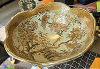 Top inside view showing detailed hand-painted birds and flowers with gold accents inside the scalloped rim bowl.