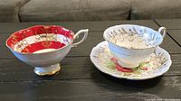 Two vintage bone china teacups and one saucer displayed on a table, showing design and condition.