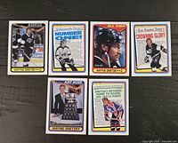 Five Wayne Gretzky hockey cards laid out front side showing player images and headlines such as Kings, Number One, All Star, Crowning Glory, and Art Ross Trophy winner.