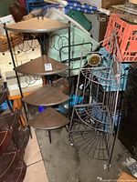 View showing both corner shelves side by side, one with wood shelves and one all metal wire shelf.