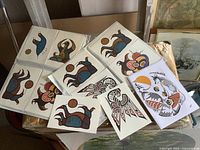 Set of Indigenous art cards with animal and nature themes visible, some stylized bears and birds