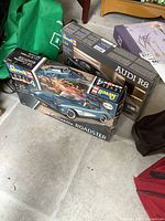 Two Revell model kits in original boxes including a 1958 Corvette Roadster and an Audi R8.