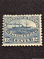 Front view of the 1860 New Brunswick Steamship 12 1/2 Cent stamp SC#10 showing the blue engraving of the steamship and denomination.