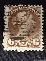 Front view of the 6 cent Canadian stamp featuring Queen Victoria with cancellation marks