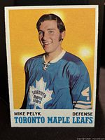 Front side of 1970-71 Mike Pelyk rookie card, showing player image in Toronto Maple Leafs uniform with team logo and card details.