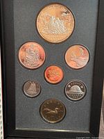 Set of 1989 Canadian Proof coins showing various denominations including 1 dollar, 50 cents, 10 cents, 1 cent, 25 cents, 5 cents, and $2 coins with wildlife and national symbols
