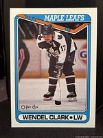 Front side of 1990-91 O-Pee-Chee OPC hockey card featuring Wendel Clark in Toronto Maple Leafs jersey.