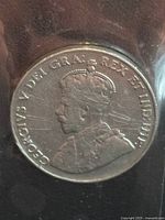 Obverse side of 1926 Canada nickel coin showing King George V portrait and inscriptions.