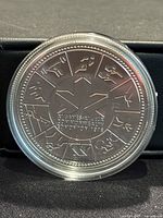Reverse of 1978 Canadian silver dollar coin with Olympic runner design, maple leaf, and bilingual inscriptions.
