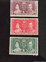 Six mint condition Newfoundland stamps from 1937 Royal Visit, colors purple, red, and green, showing portraits of King George VI and Queen Elizabeth, some with slight hinge marks.