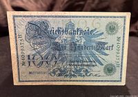 Front side of the 1908 German Reichsbank 100 Mark banknote with denomination and text.