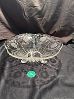 Front angled view showing the 10 inch wide etched glass bowl with cornflower floral pattern and three rounded feet