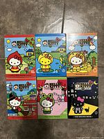 Six Hello Kitty Fairy Tales plush dolls in their original collectible boxes, each themed to a different fairy tale or promotion.