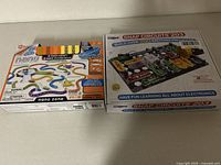 Box of Hexbug Nano Zone STEM Kit and Snap Circuits 203 Kit side by side showing packaging and front labels.
