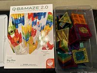 Original box for Q-BA-MAZE 2.0 Big Box featuring colorful cubes and marbles graphic