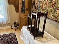 View of antique mahogany umbrella and walking stick stand showing overall structure and polished finish