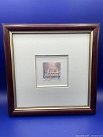 Framed original watercolour painting shown with white mat and reddish-brown wooden frame, overall size approximately 10x10 inches.