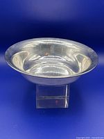 Front angled view of sterling silver bowl showing polished surface and curved form
